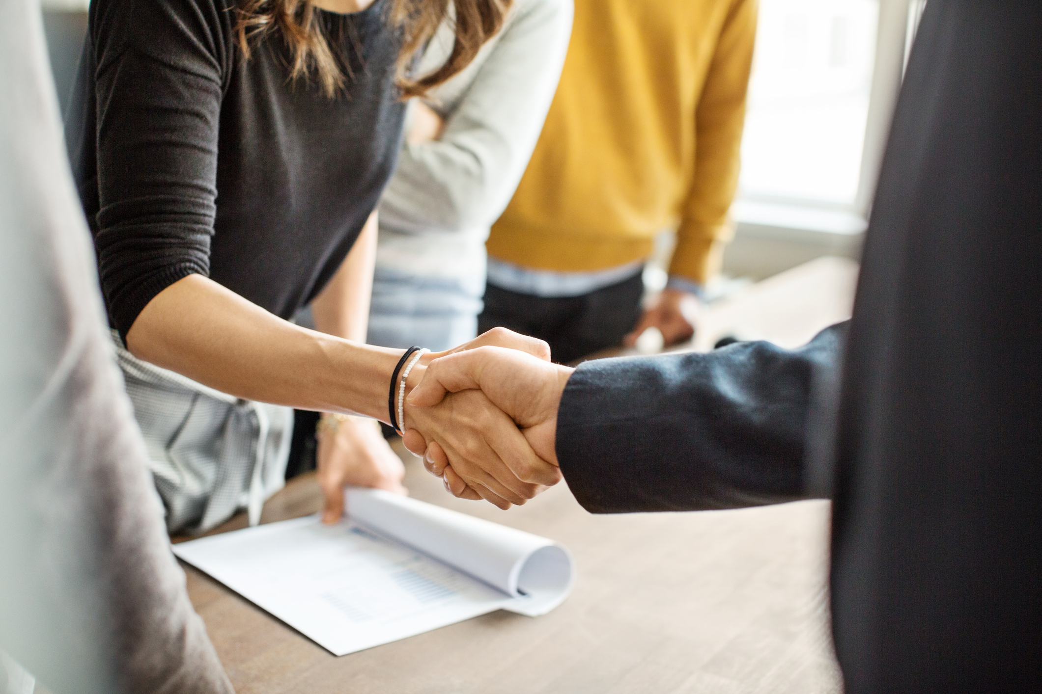 Business people shaking hands in office Business people shaking hands in office